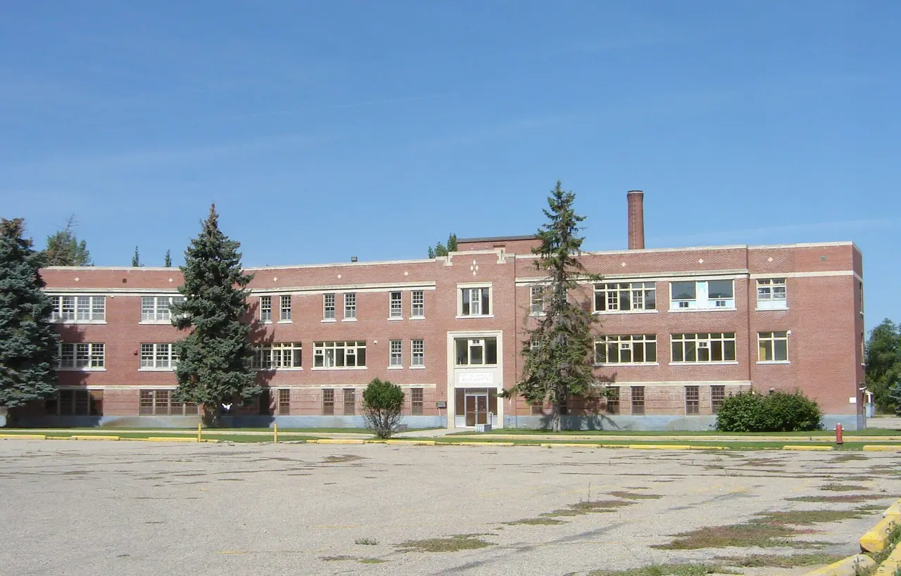 Large brick building with parking lot, about 2008