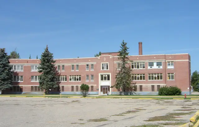Large brick building with parking lot